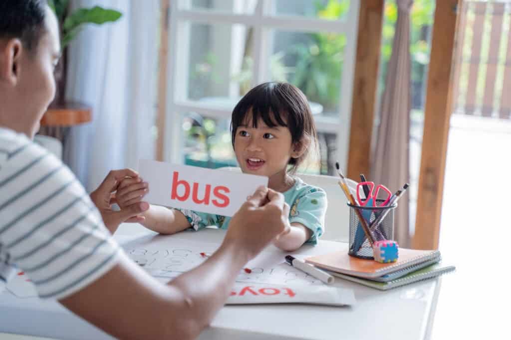 student reading flashcard